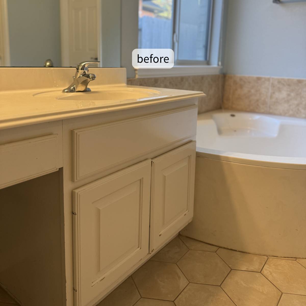 Before photo of a dated corner tub, beige ceramic tile and chrome fixtures before a luxury bathroom remodel in Cedar Park, TX by ATX Custom Remodel.