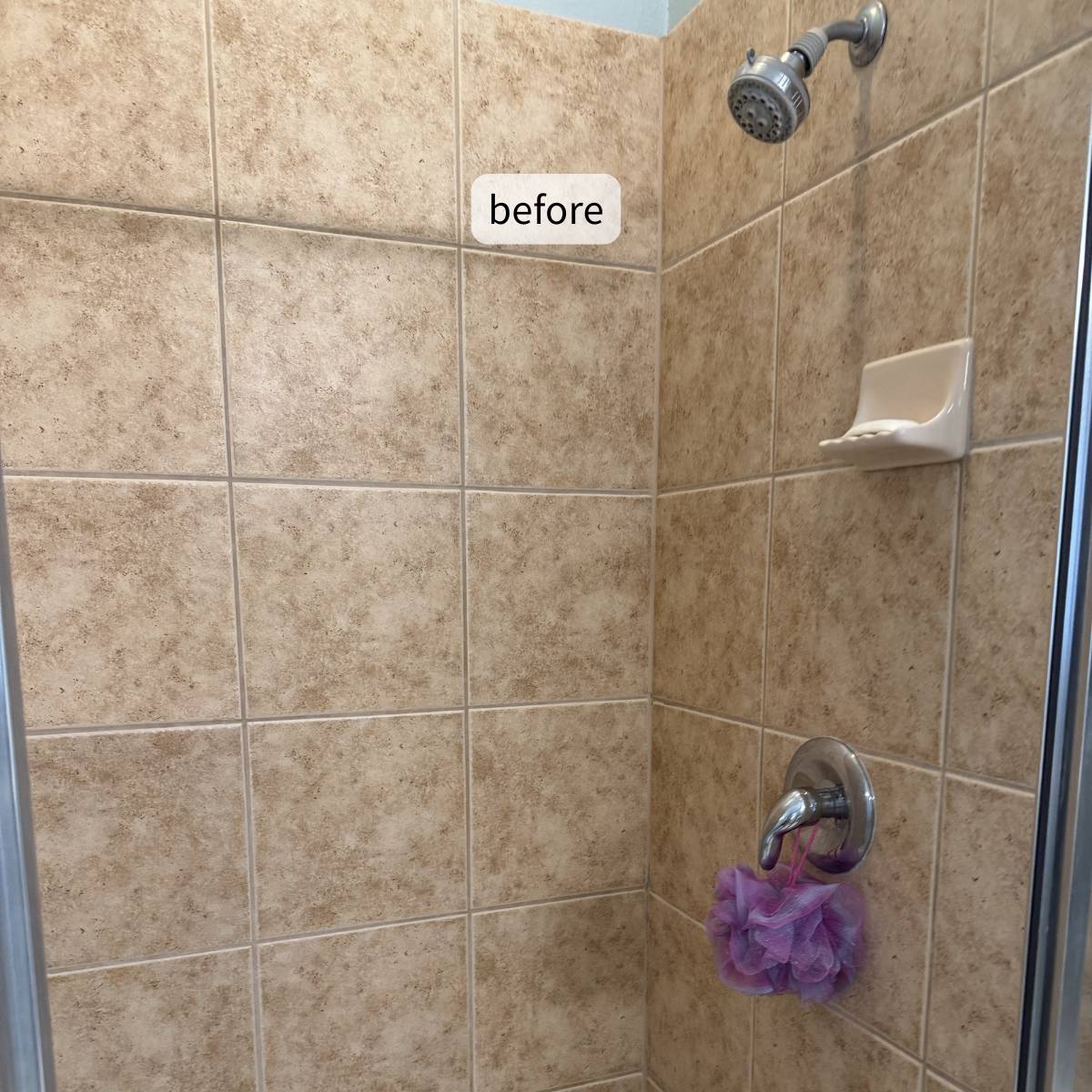 Before photo of a dated primary bathroom shower with beige ceramic tile and chrome fixtures before a luxury bathroom remodel in Cedar Park, TX by ATX Custom Remodel.
