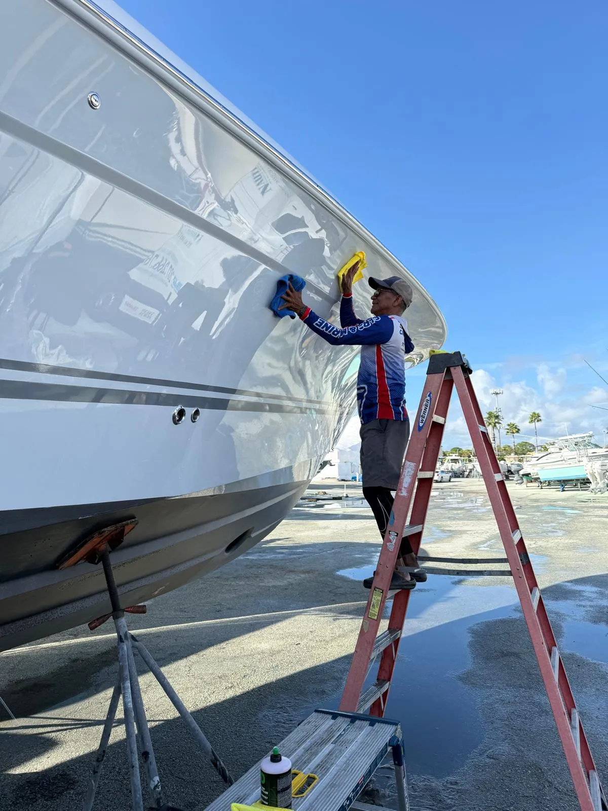 Jose at work inspecting automotive paint correction and boat gelcoat detailing