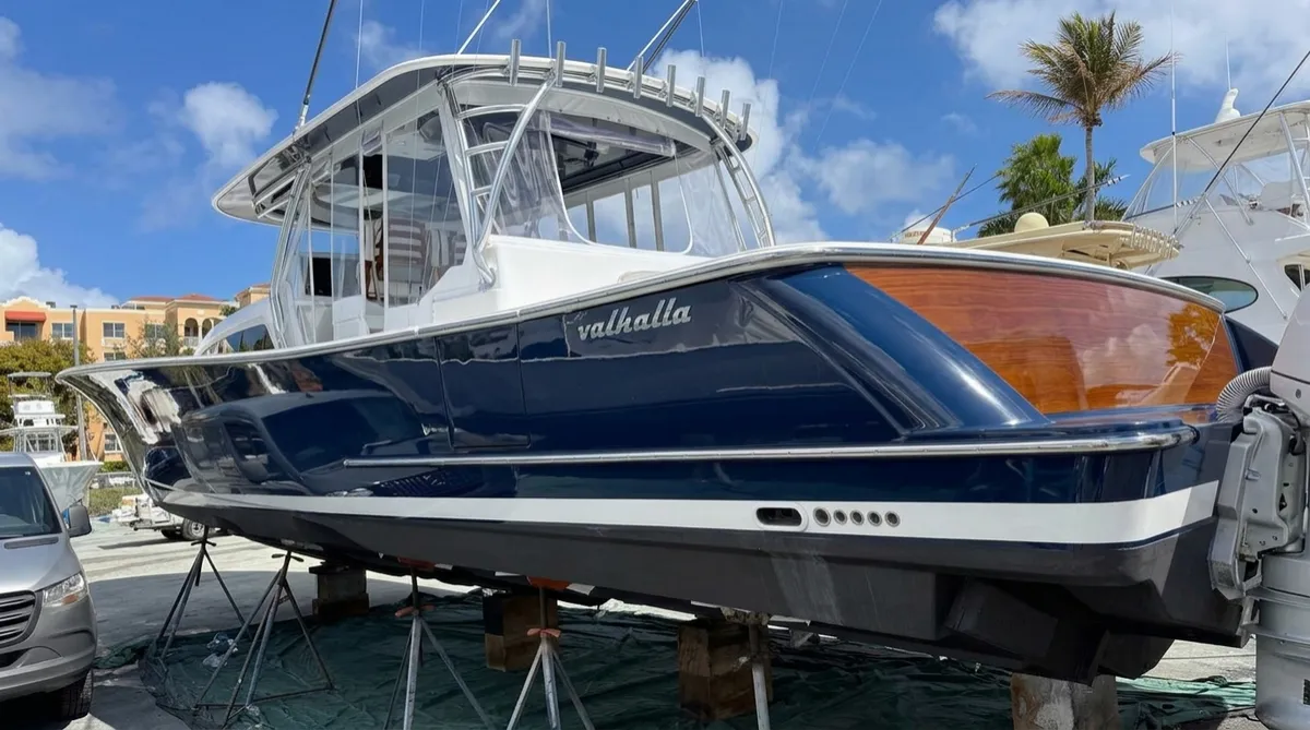 Marine detailing heavy oxidation removal and ceramic coating on center console luxury boat hull