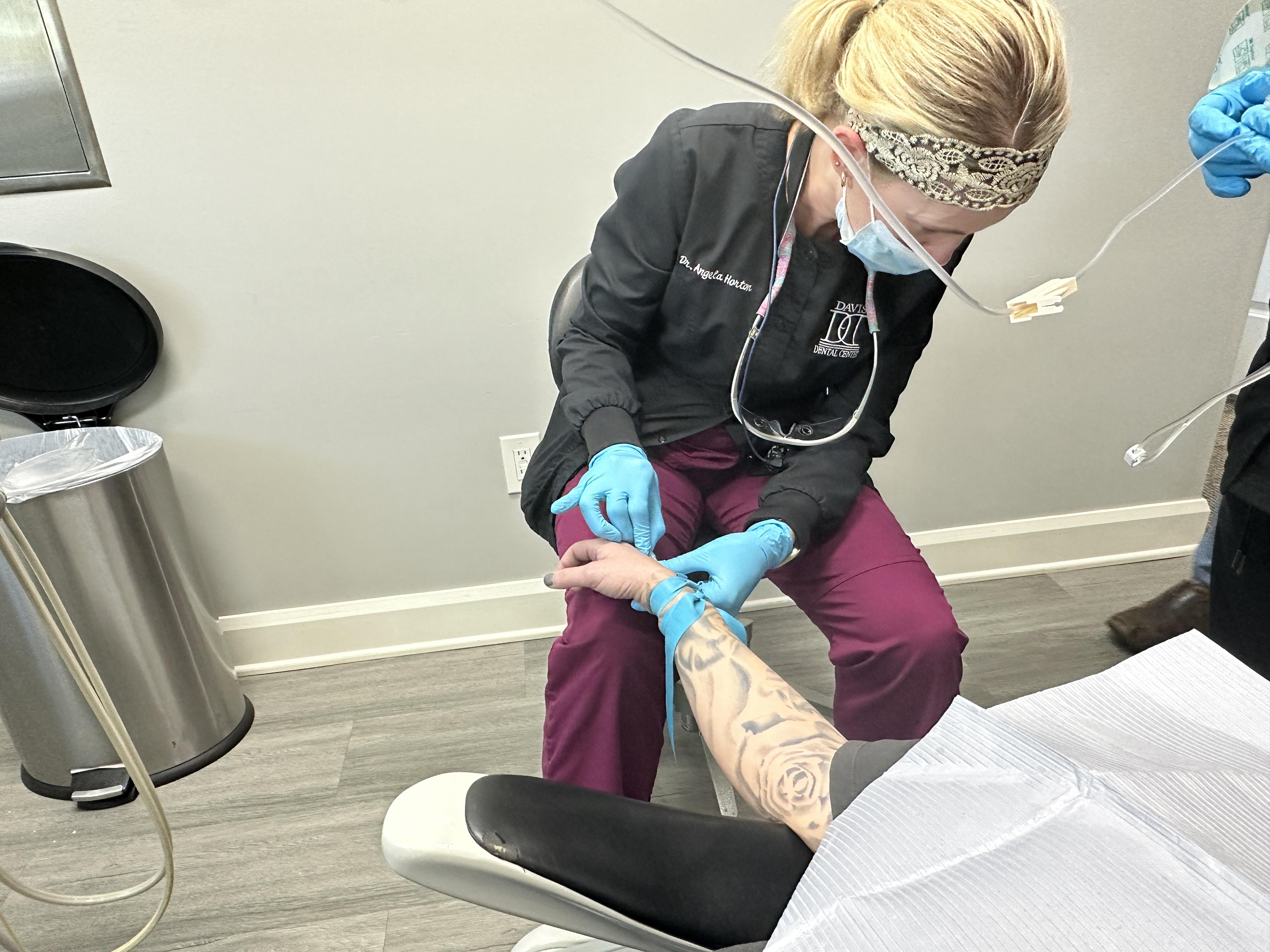 Dentist treating patient