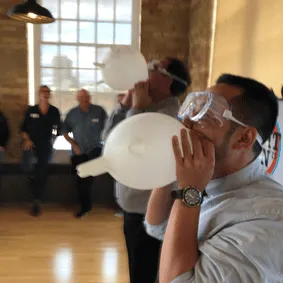 Motivational speaker with funny face at Axe Throwing event