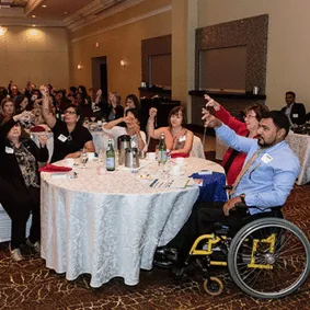 Motivational speaker wearing a vest in deep thought