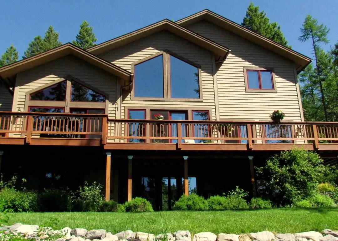 Elevated composite deck with privacy screening in Northwoods Whitefish MT