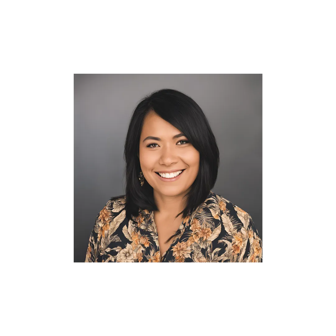 Woman with multi-colored shirt smiling