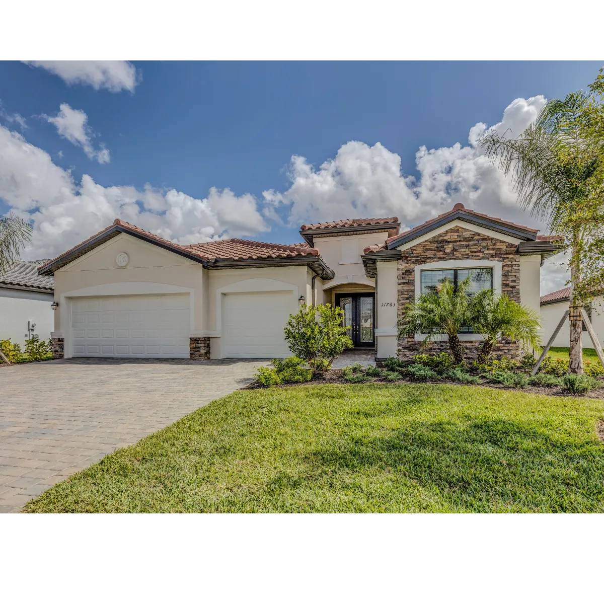 house made of stucco with green lawn