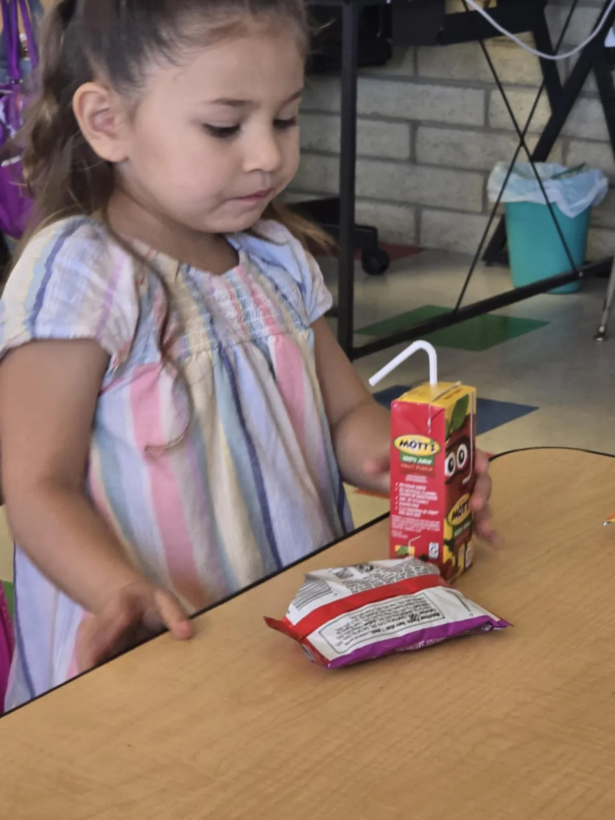 Child waves at laptop