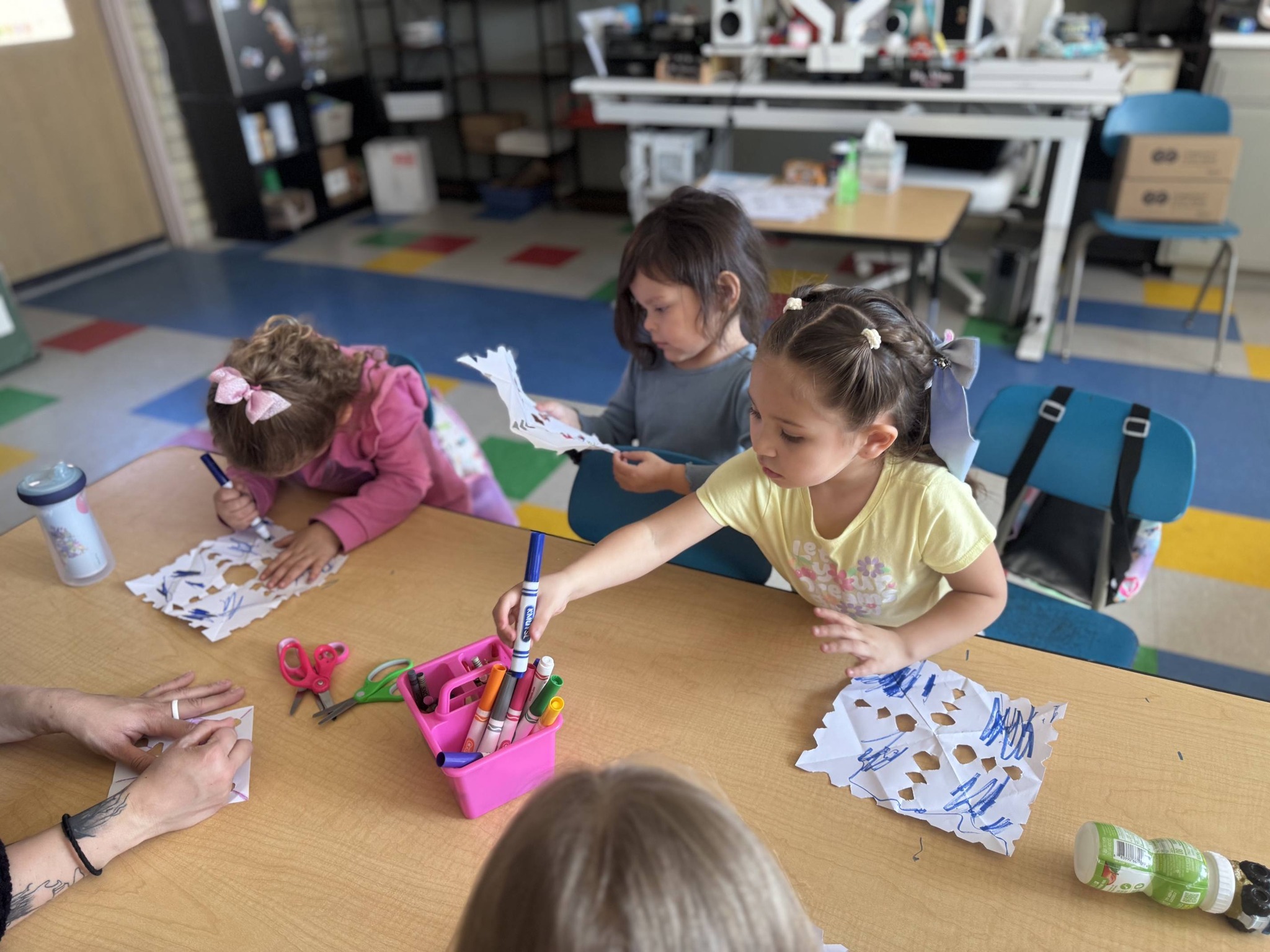 Girl follows directions during arts and crafts time.
