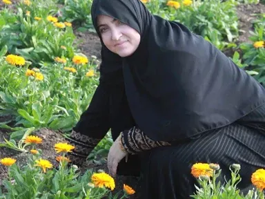 Editorial-style portrait of a handcrafted botanical figure with rustic twine and natural textures.