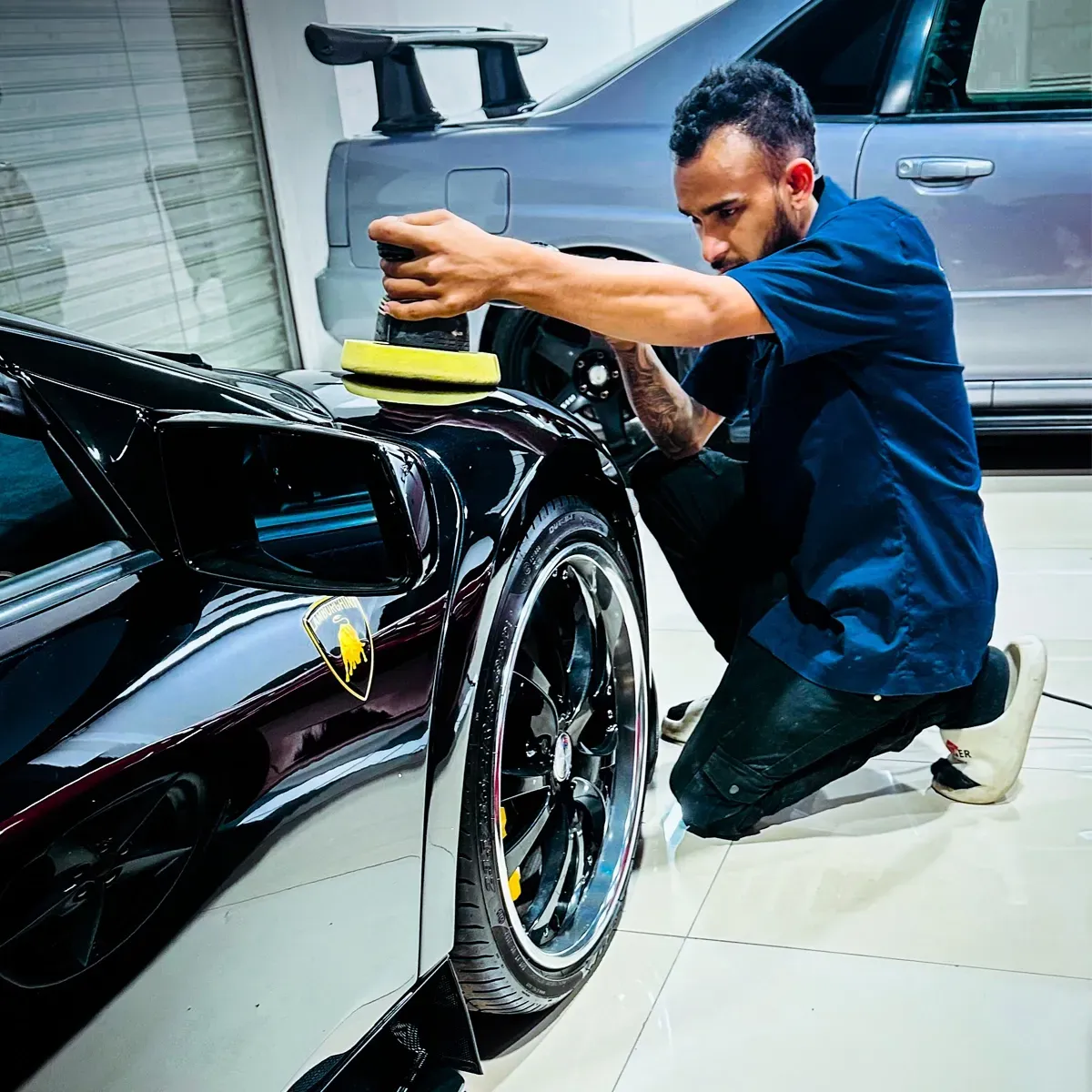 Detailer doing the Ceramic Coating
