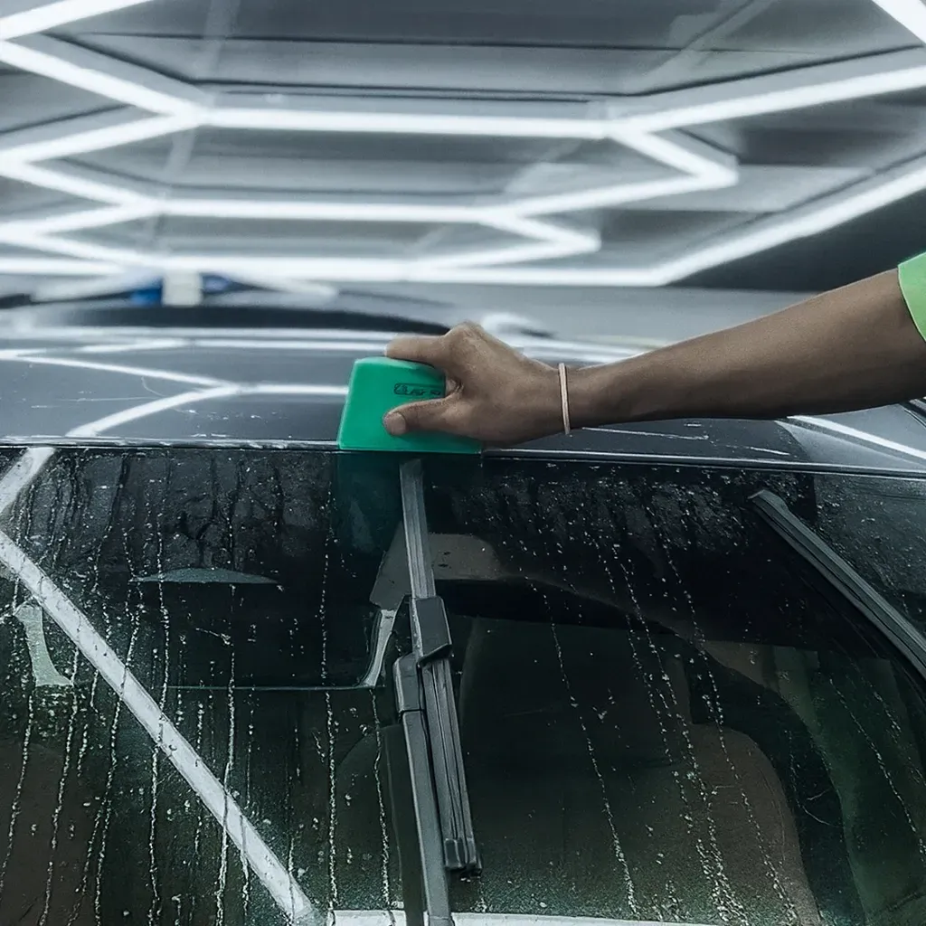 Detailer doing PPF installation