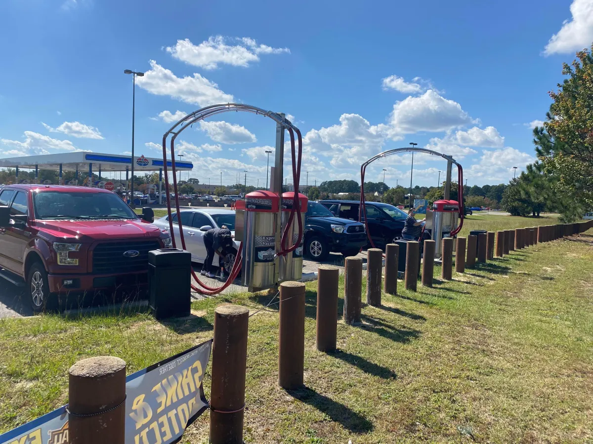 Picture of vehicles at car wash vacuums