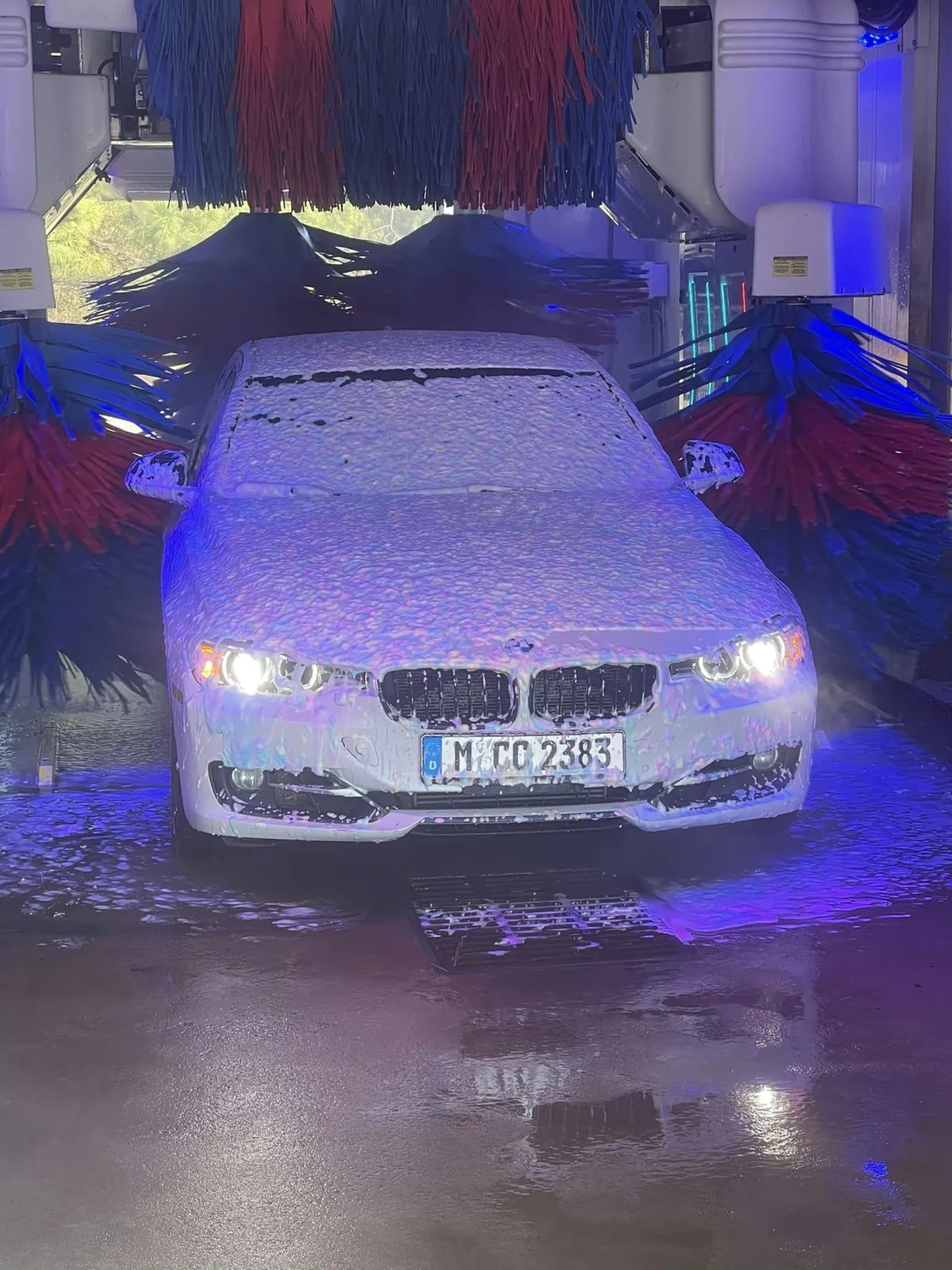 A car going through a car wash at Defense Auto Wash