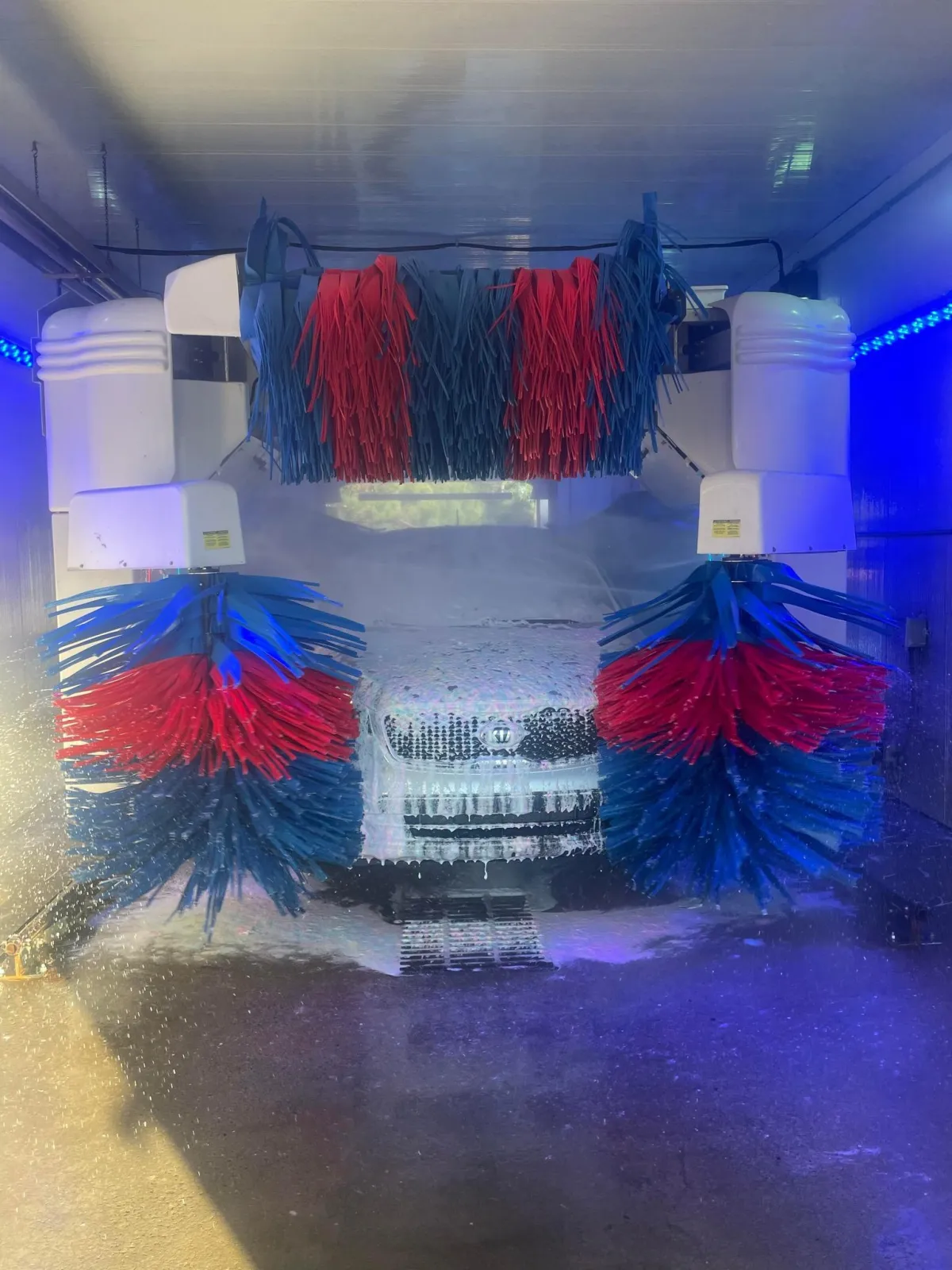 A car going through a car wash at Defense Auto Wash