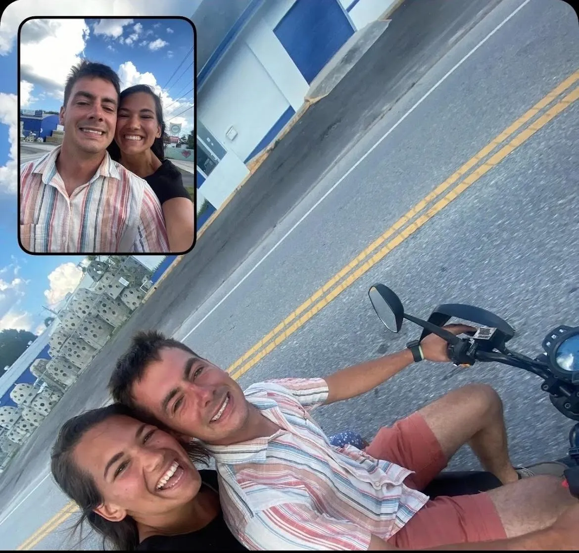 Happy couple riding a Bosco Rentals two-seater scooter in Sarasota, FL, taking a selfie during their beachside adventure.