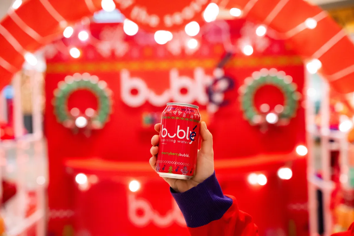 A hand holds a can of Bubly at the launch event for the new Merry Berry flavour in Vancouver. 