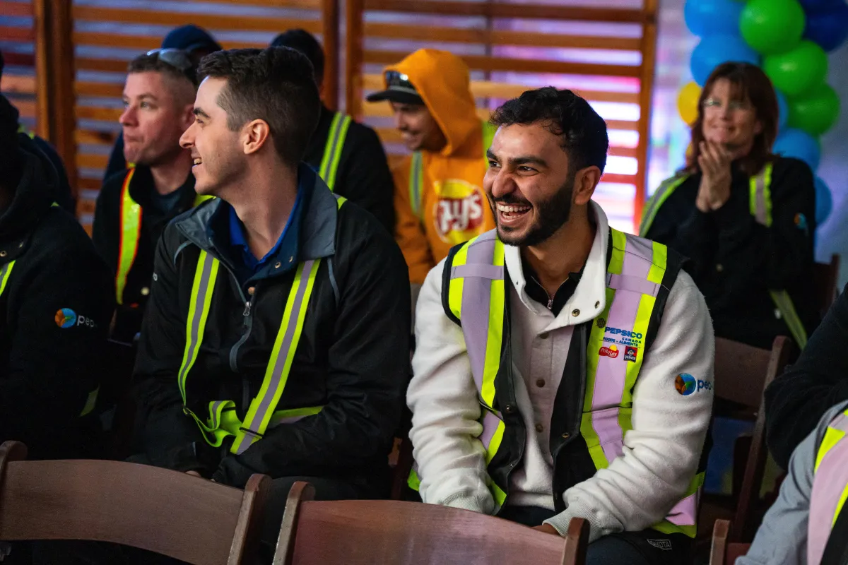 A man laughs at a corporate event in Vancouver