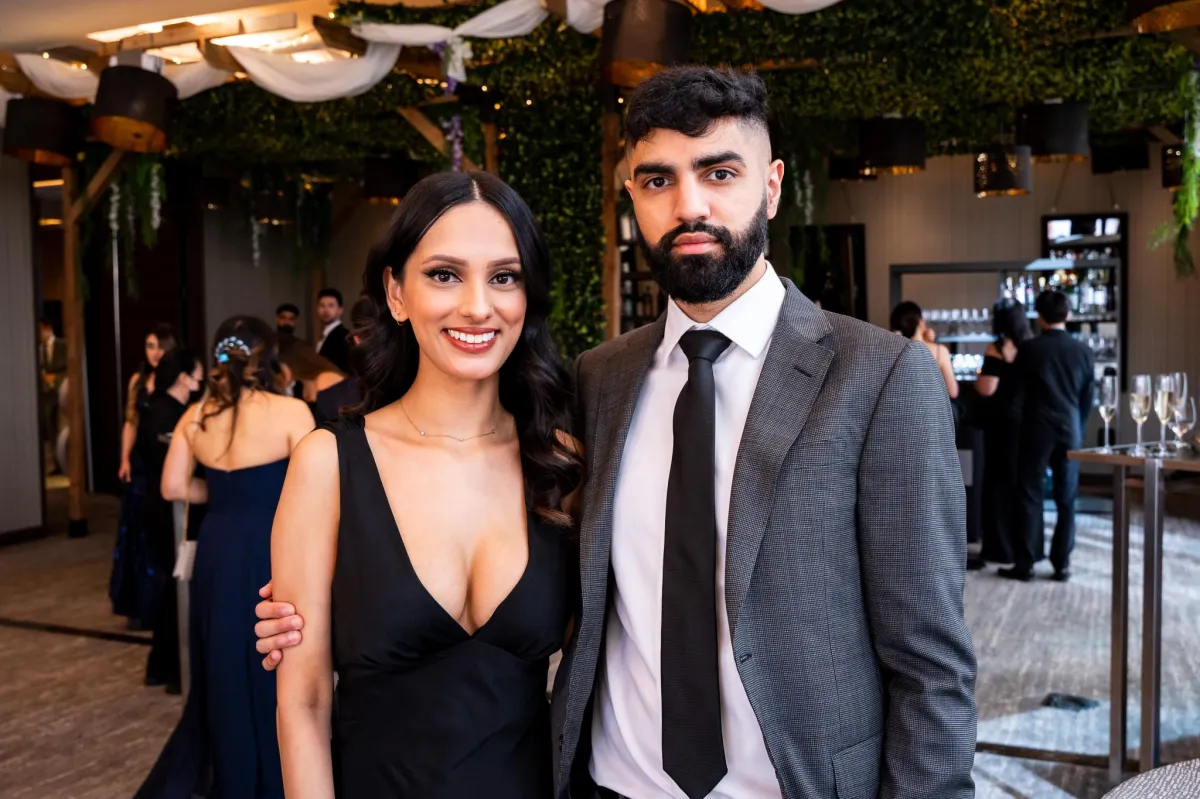 A couple pose for a photo at UBC Dental Ball in Vancouver