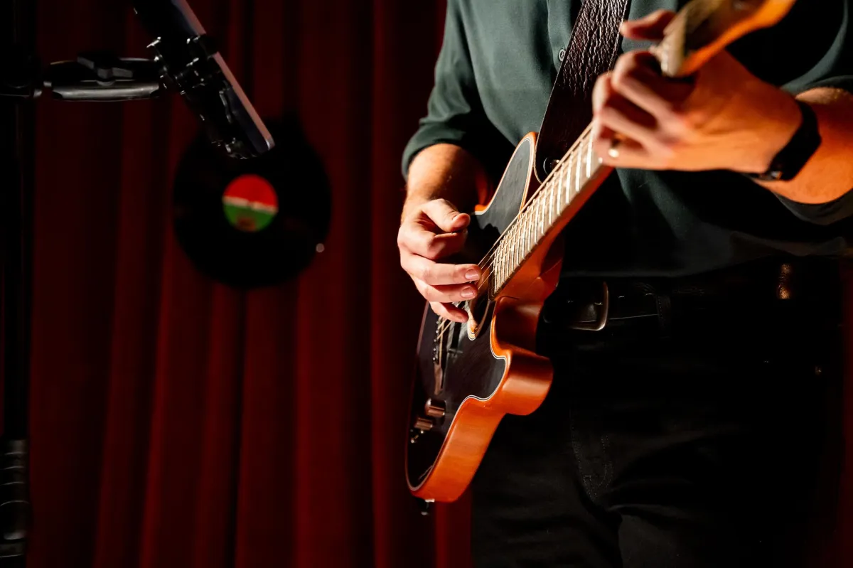 A guitarist performs during a music event in Vancouver