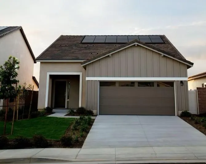 Home with solar panels on roo