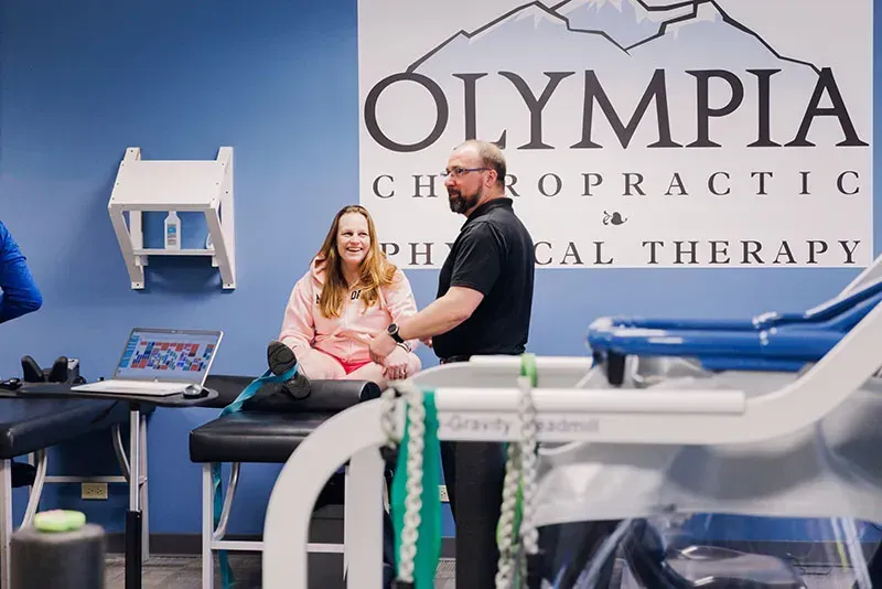SpineEase 3000 spinal decompression table in a bright clinic room