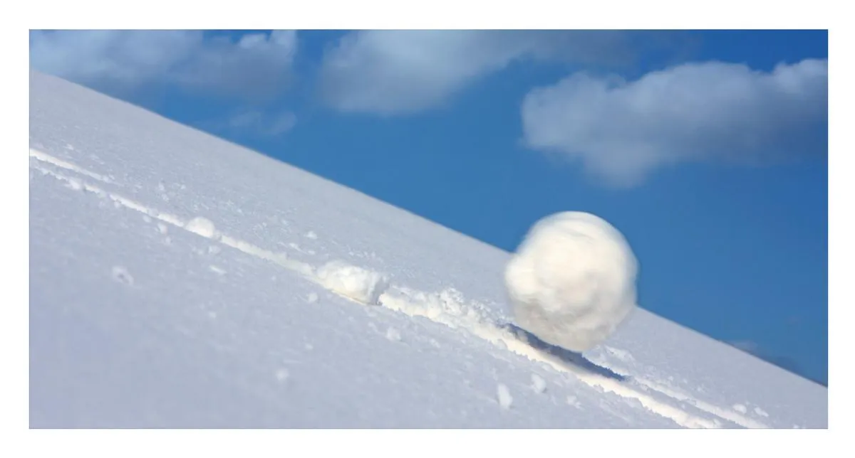 Snowball rollng down a hill representing compound inerest