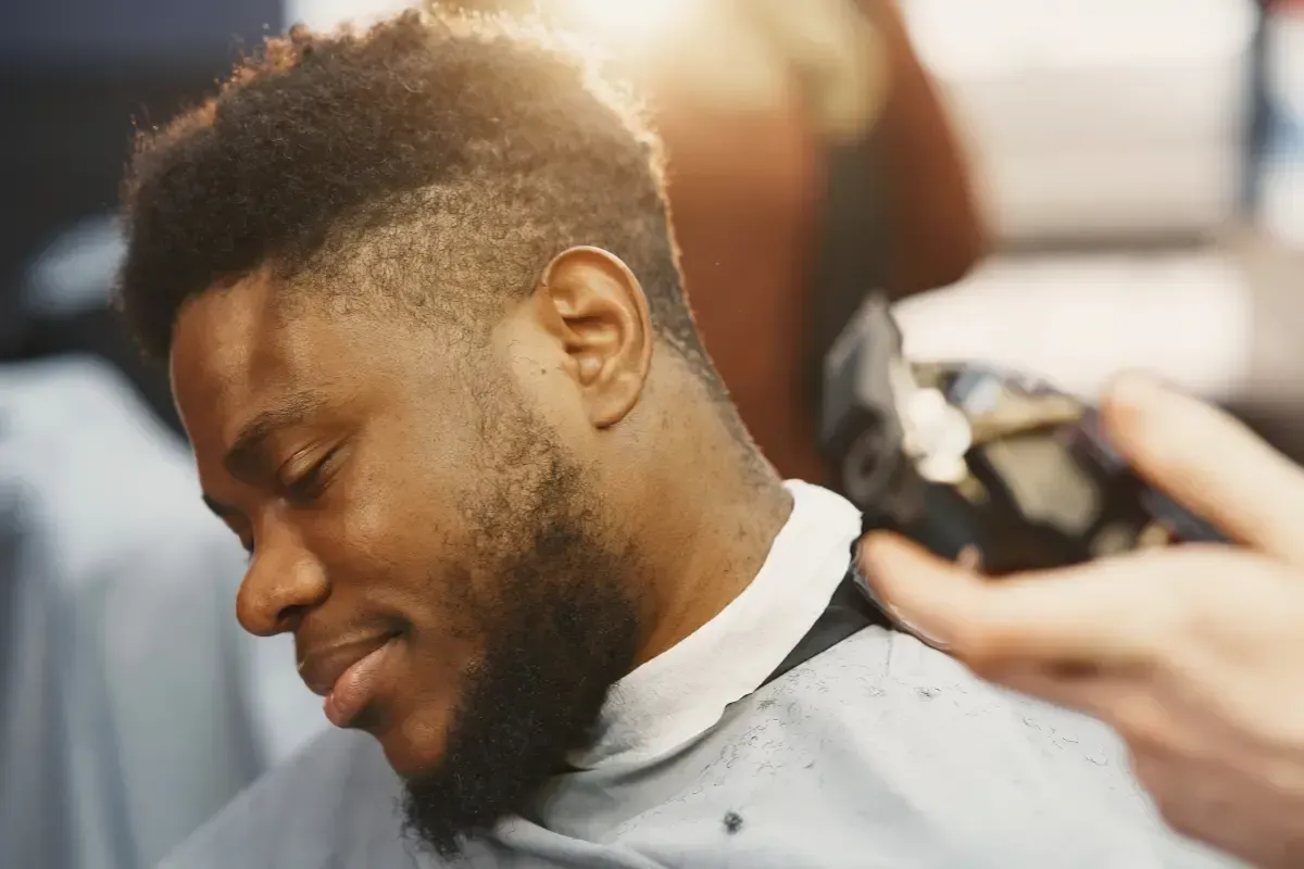 Man receiving a fade haircut at Scuttlebutt Barbershop in Portsmouth, NH