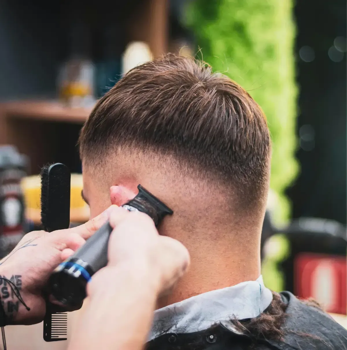 Barber giving a clean low fade haircut at Scuttlebutt Barbershop in Portsmouth NH