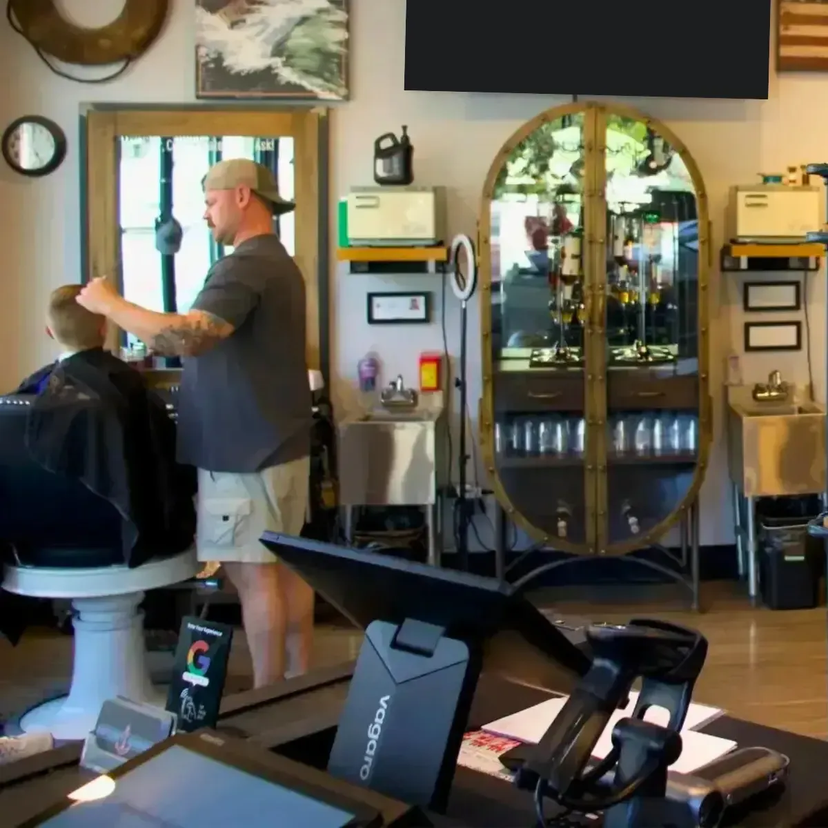 Scuttlebutt Barbershop barber giving a precision haircut inside the Portsmouth NH shop