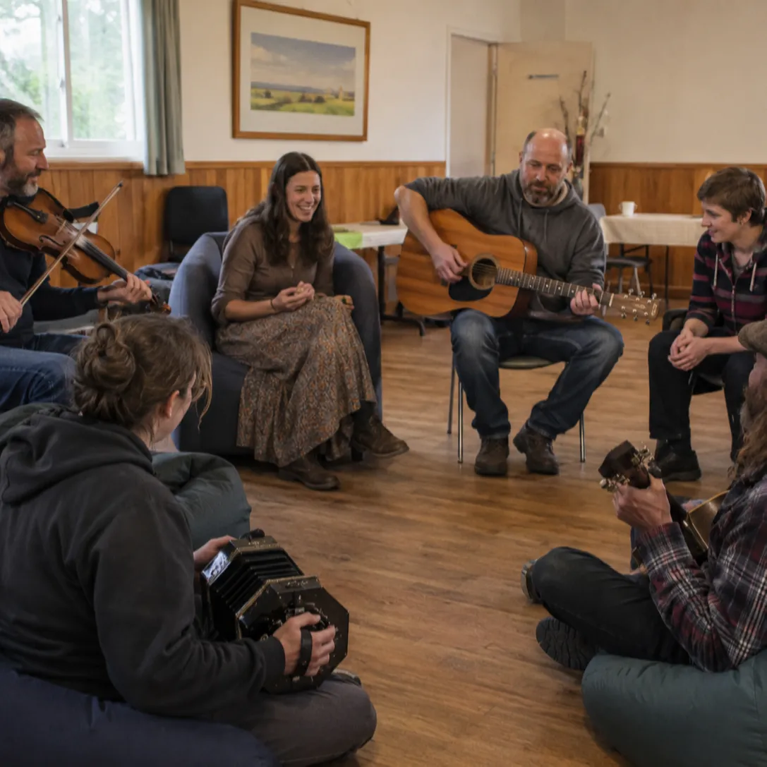 a circle of people making music together