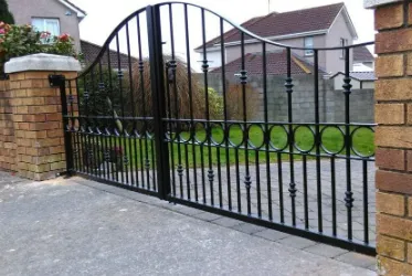 Black Metallic Ornamental Sing Gate Entrance to a High End Residential Property