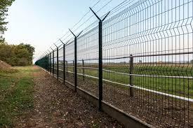 8ft Chain-link fence with 3 strand barbed wire depicting a secure area