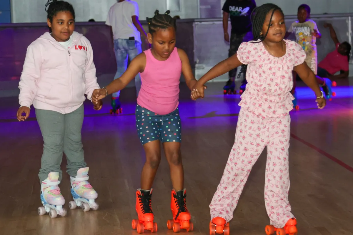 Youth skating together during Skate On Purpose, a family-friendly community event hosted by The Born On Purpose Project in Broward County, Florida, promoting youth engagement, family connection, mentorship, and positive community experiences through recreational activities.