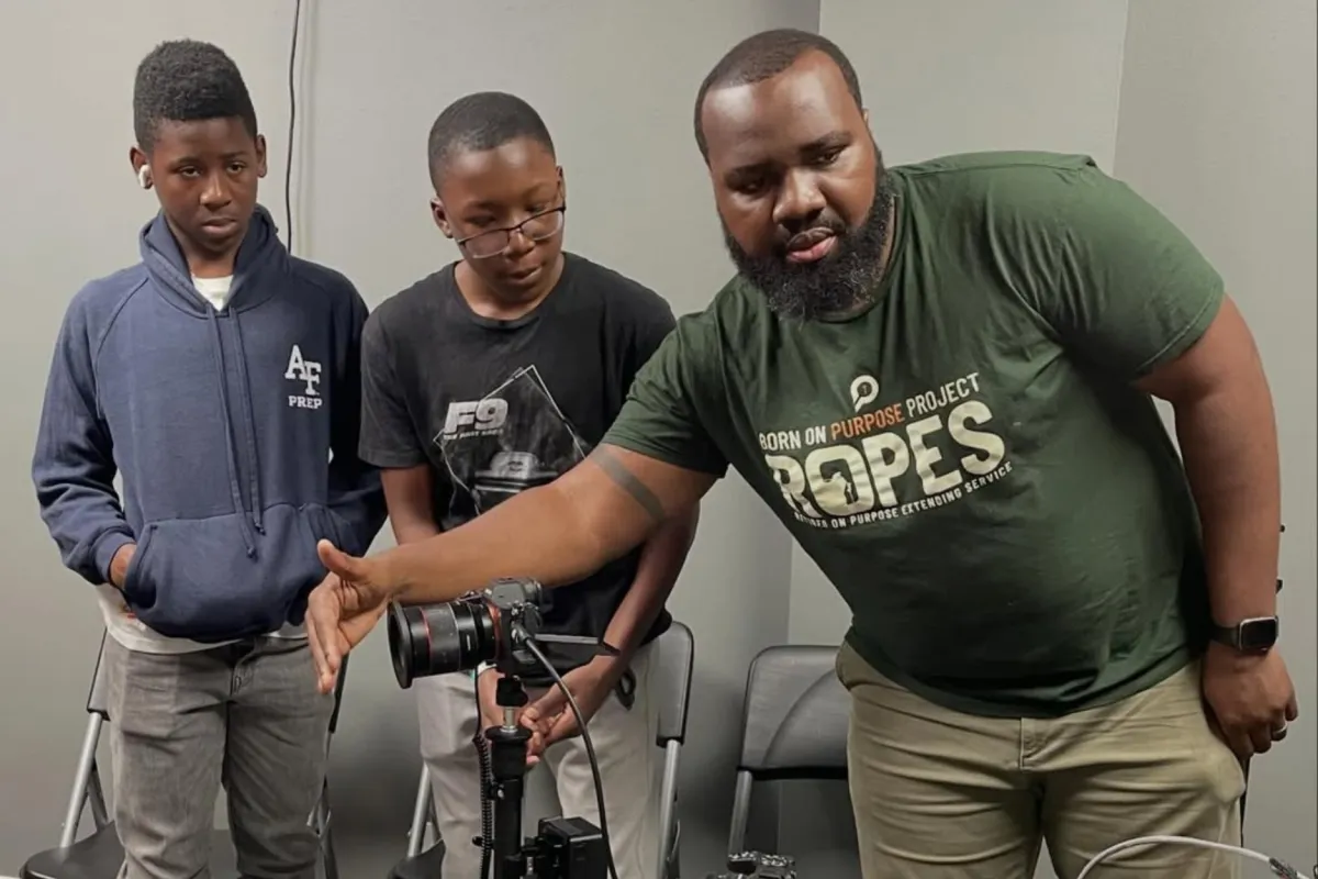 R.O.P.E.S. mentor Guil Dormeus teaching youth podcast production, camera operation, and storytelling skills during Podcast On Purpose at The Born On Purpose Project mentoring and media training session in Broward County, Florida.