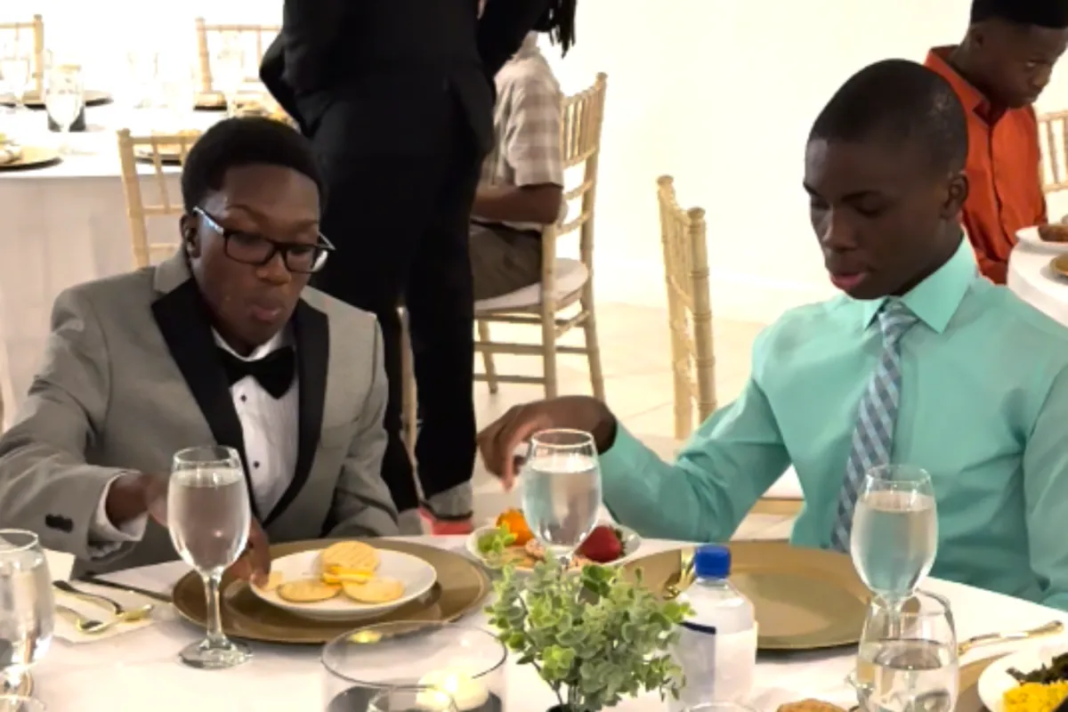 Youth participants practicing table etiquette and dining skills during Sunday Dinner hosted by The Born On Purpose Project, a mentorship and leadership development experience focused on life skills, community connection, and positive youth development in Broward County, Florida.