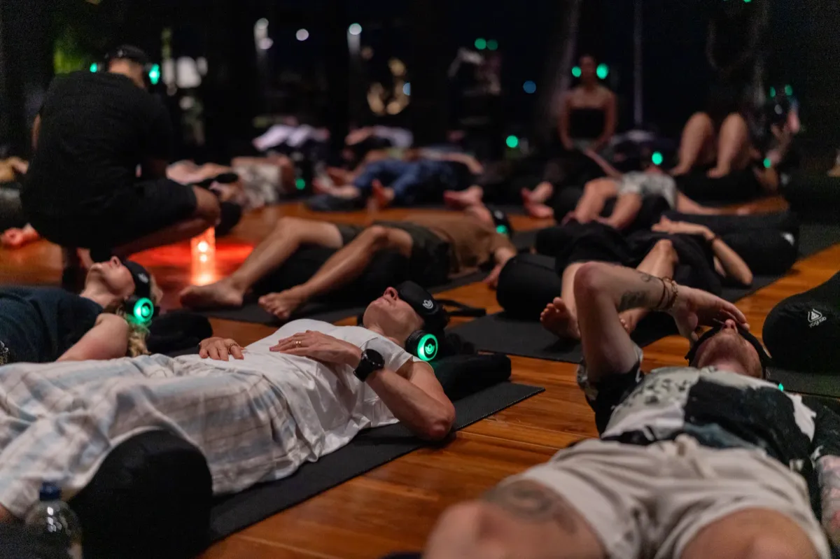 Small group sitting in an intimate wellness setup