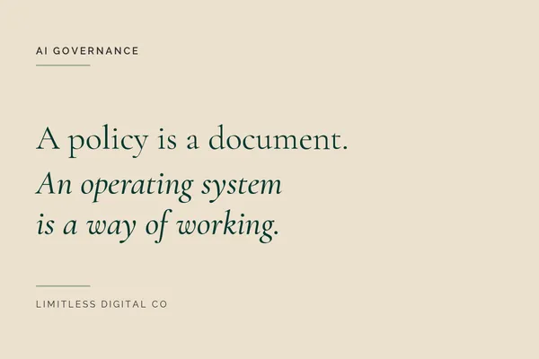 Small business owner reviewing an AI governance operating system on a laptop in a Wollongong office