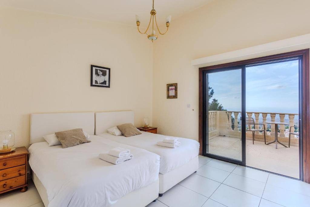 Serene and minimalist double guest bedroom at our boutique Paphos villa, designed for deep rest and somatic safety.