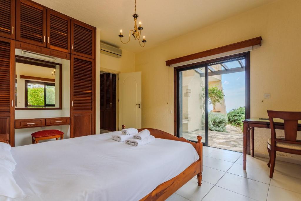 Serene and minimalist guest bedroom at our boutique Paphos villa, designed for deep rest and somatic safety.