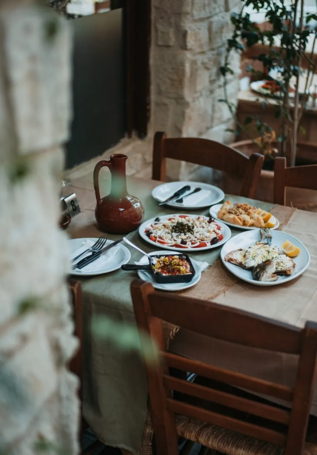 A vibrant table of nourishing Mediterranean cuisine, locally sourced for gut health and communal nourishment.