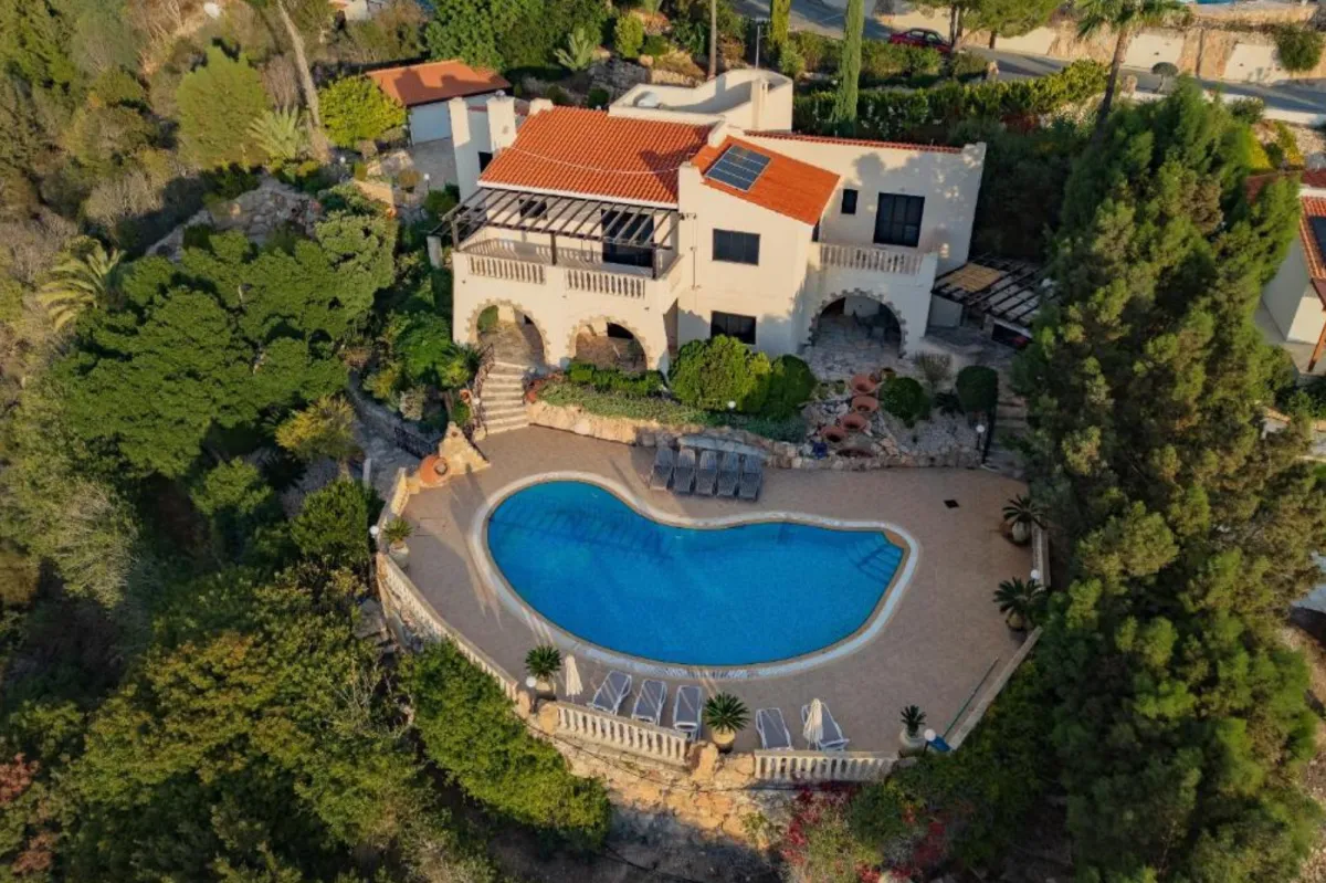 There is an open-plan living area of our boutique Paphos villa, designed with soft textures and natural light to support nervous system regulation.