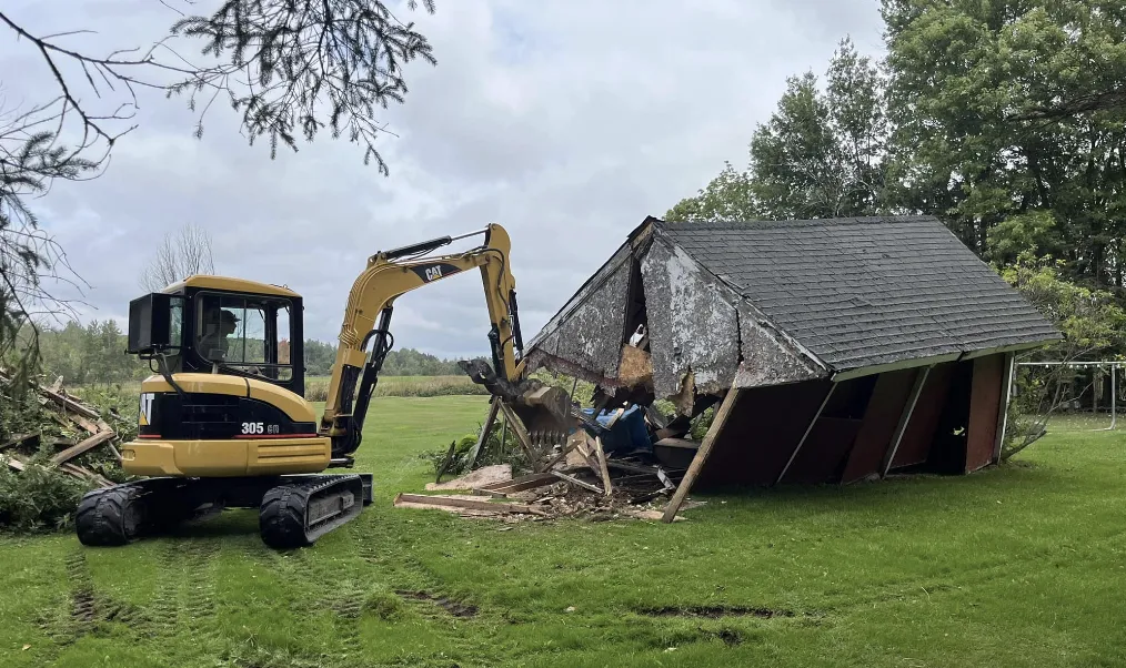 excavator doing demolition services