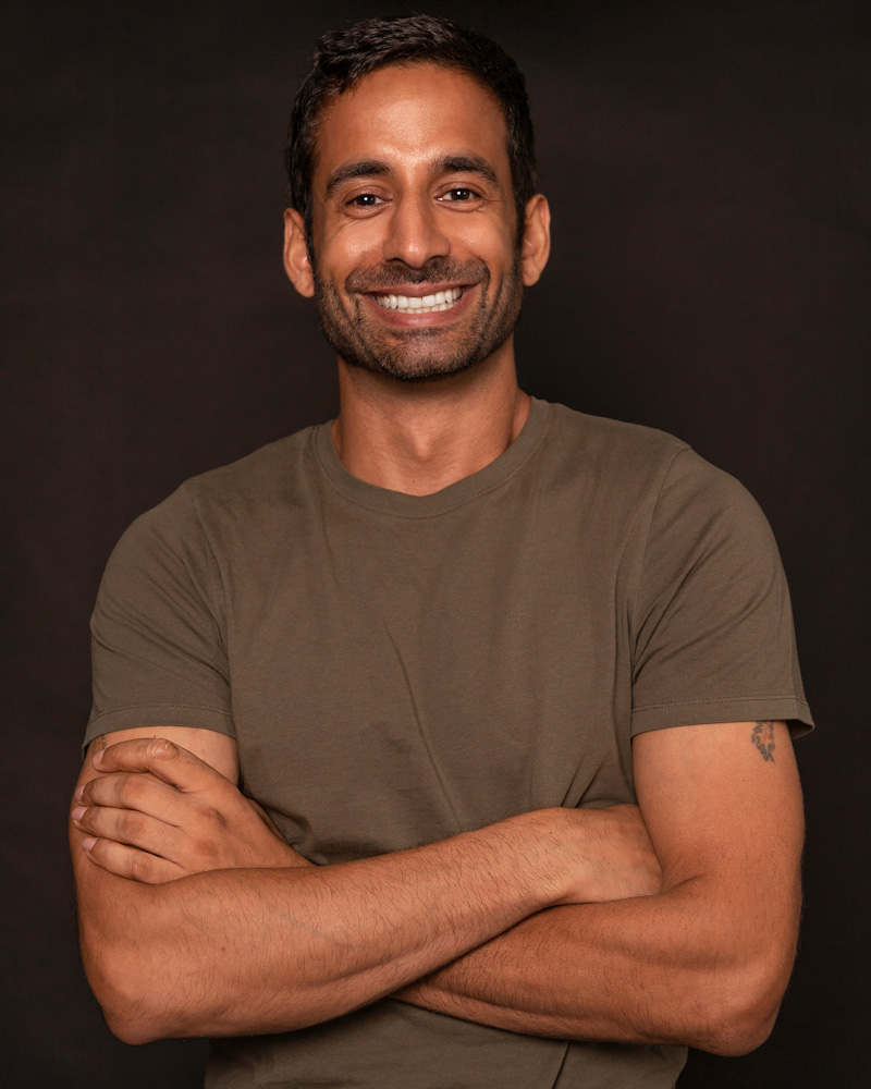 Consultant in a clean modern workspace reviewing tech stack metrics