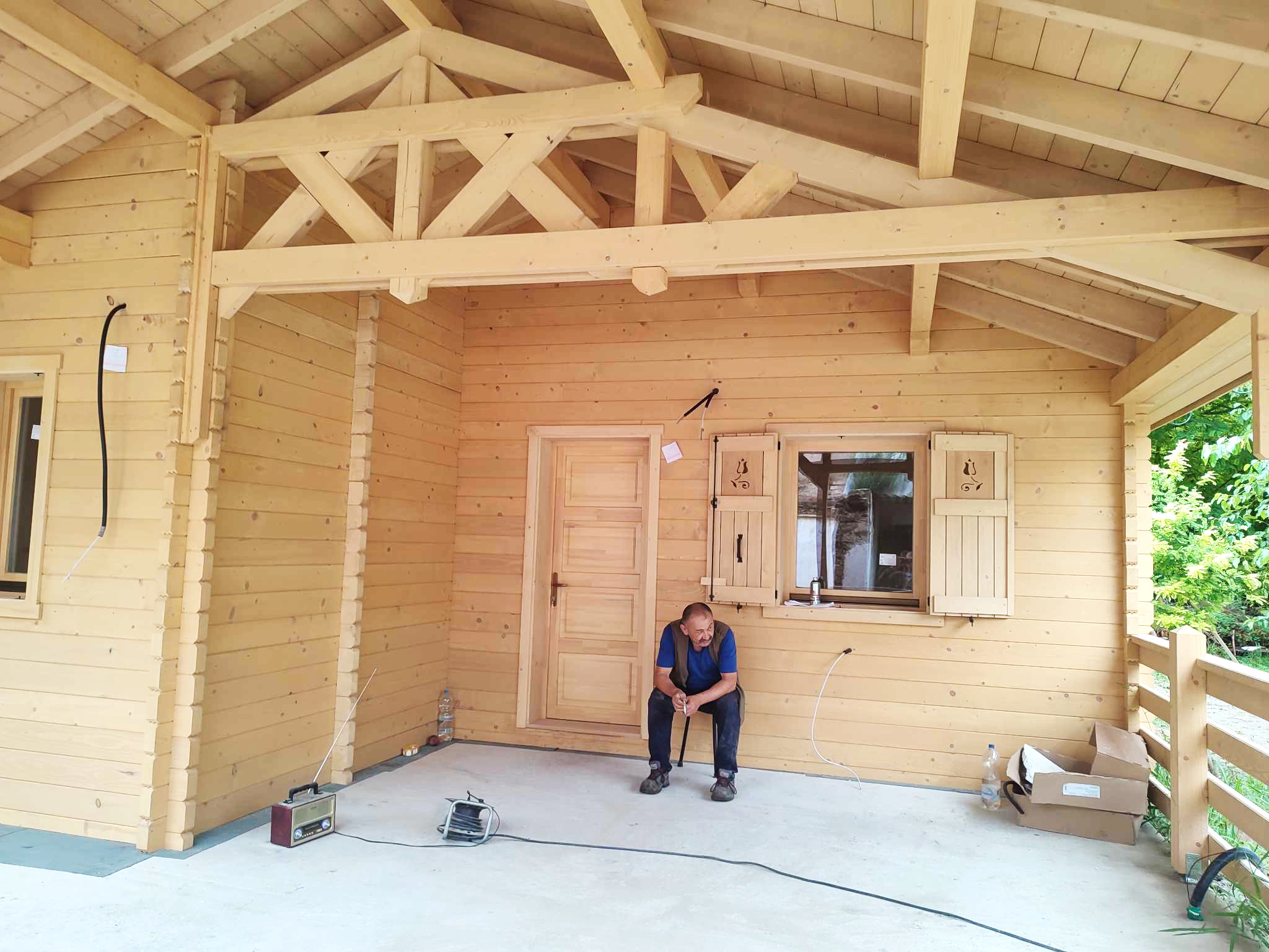 people in green and blue jacket walking on dirt road during daytime