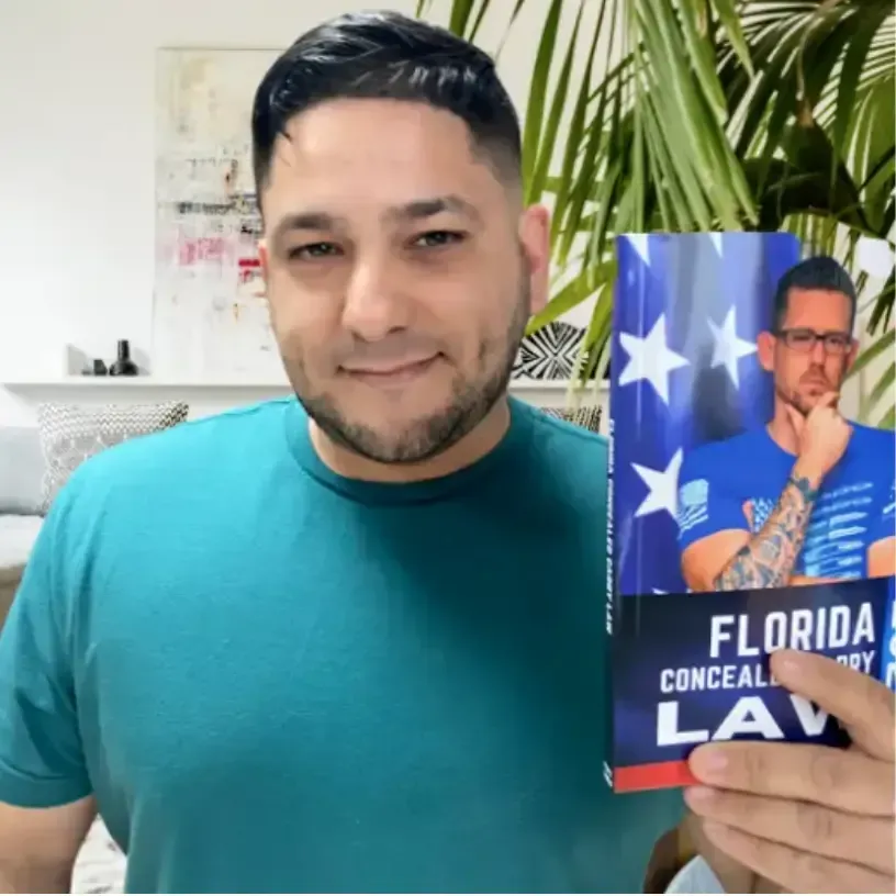 Students holding Florida Concealed Carry Law book