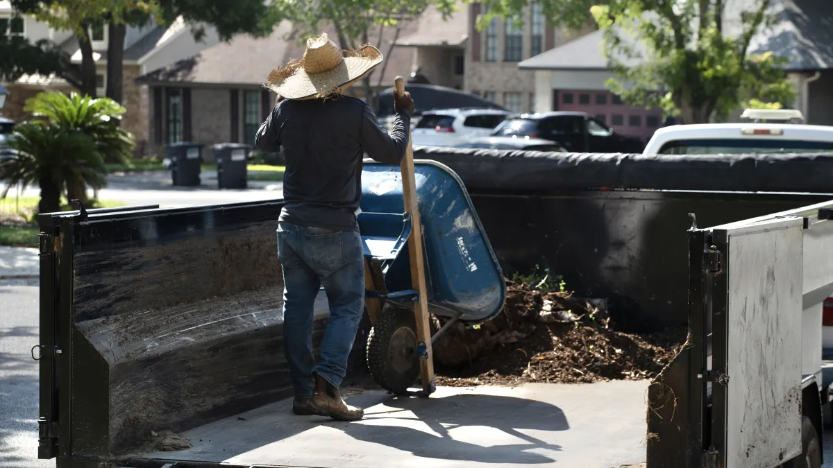 Residential lawn mowing with gas-powered machine
