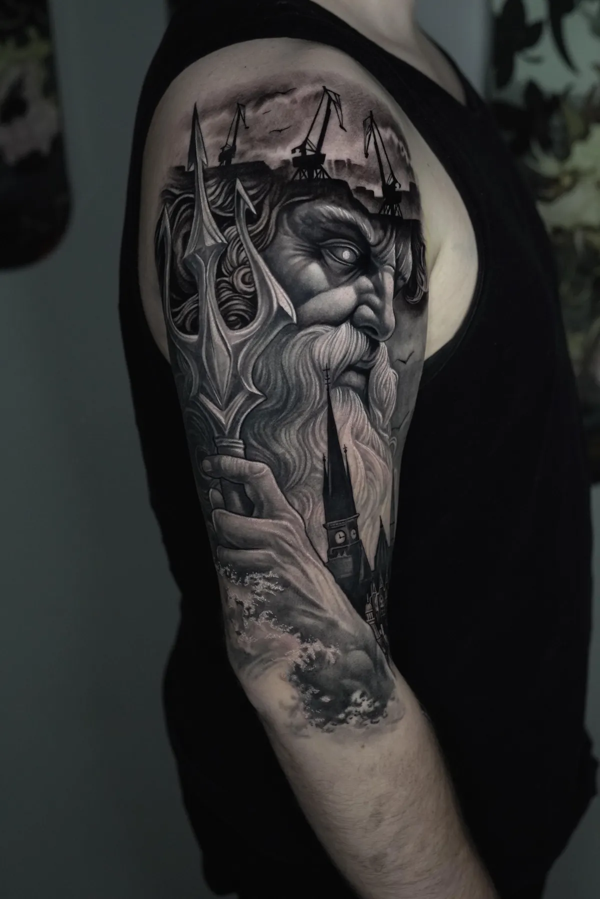 person doing flower tattoo on leg