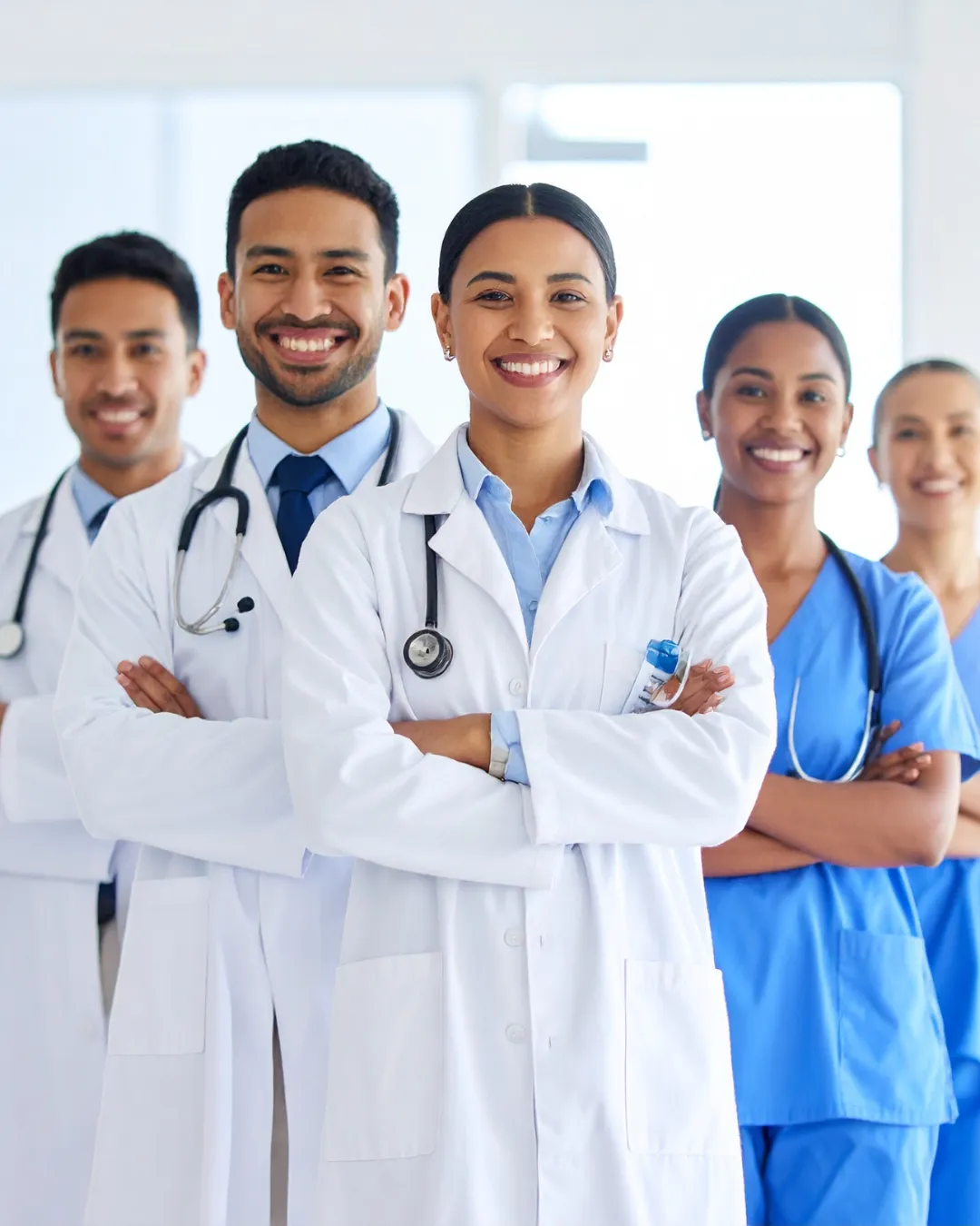 A multidisciplinary team of healthcare professionals, including an oncologist, a nutritionist, and a care coordinator, collaborating in a modern clinic office, reviewing patient files and discussing treatment strategies.