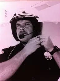Close-up of a handshake between Connor and a client in a modern Santa Clarita office, with legal documents and a city map visible on the table. The scene conveys professionalism and trust.