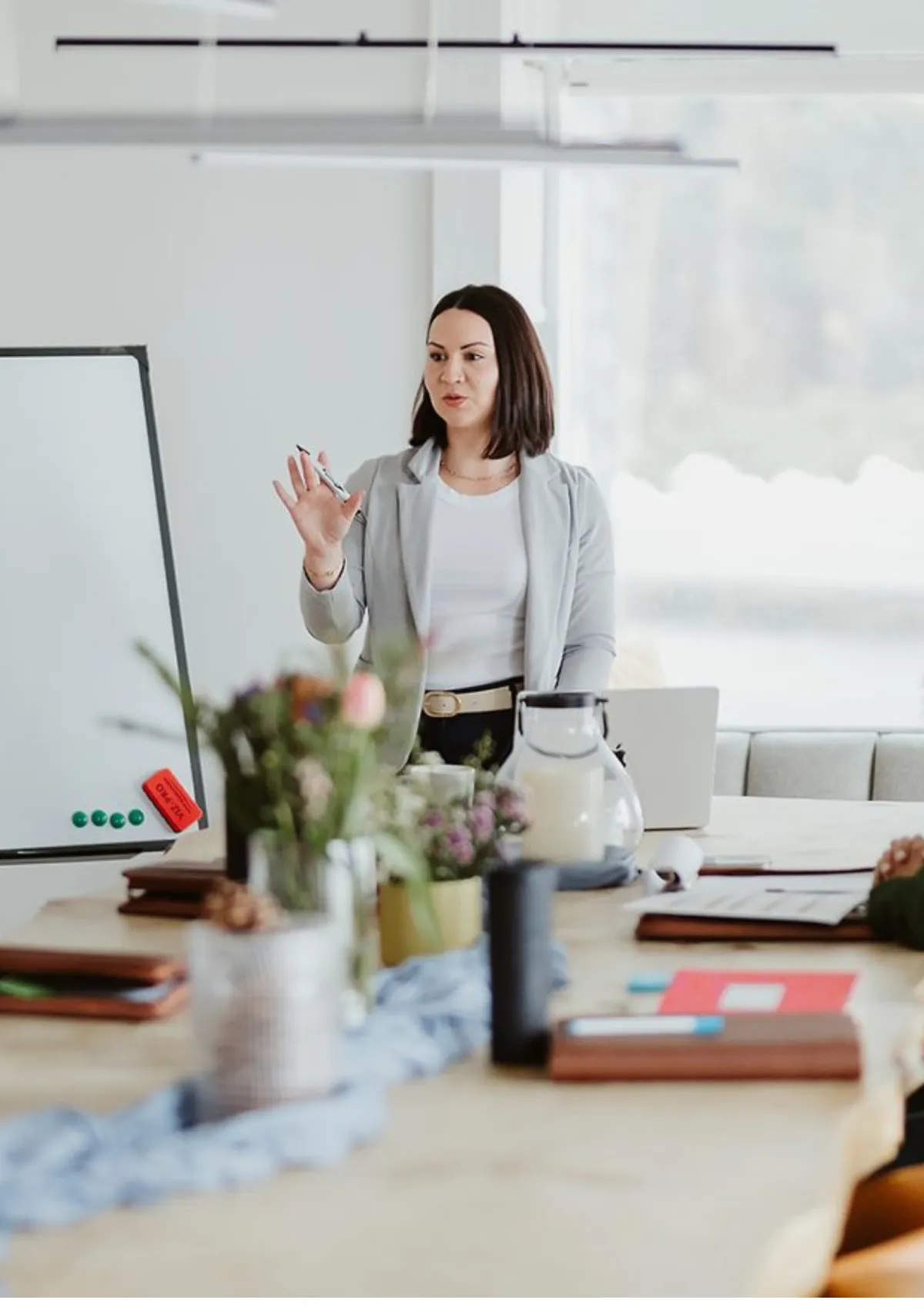 Woman presenting at whiteboard